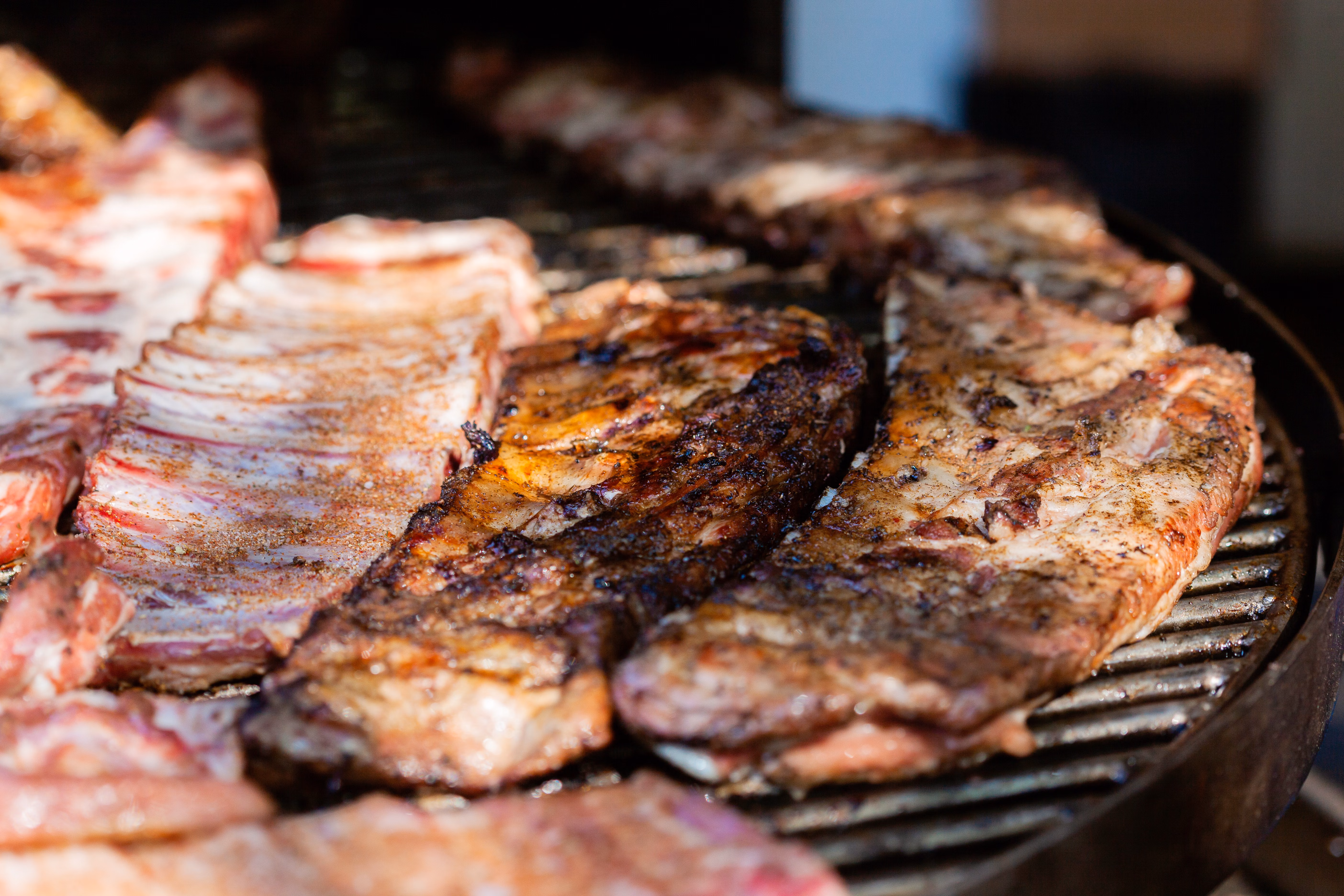 Spit braai roasting over open coals